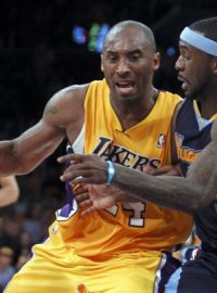 Los Angeles Lakers shooting guard Kobe Bryant  (24) bumps into Denver Nuggets point guard Ty Lawson (3) defending in the fourth quarter during Game 2 of their NBA Western Conference playoff in Los Angeles